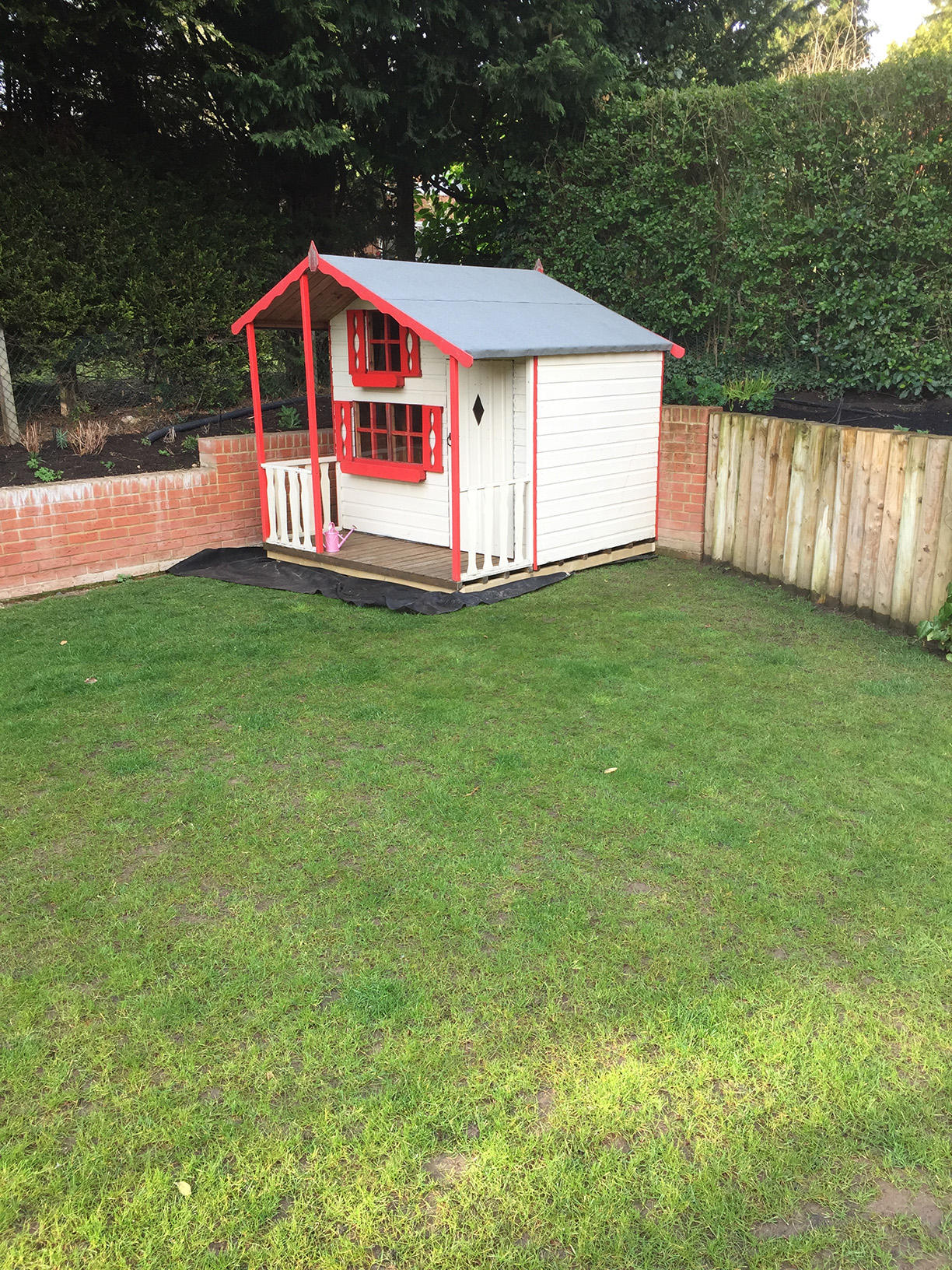 Picket fence surround enclosing play area