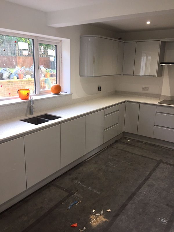 Full view of finished white and grey kitchen